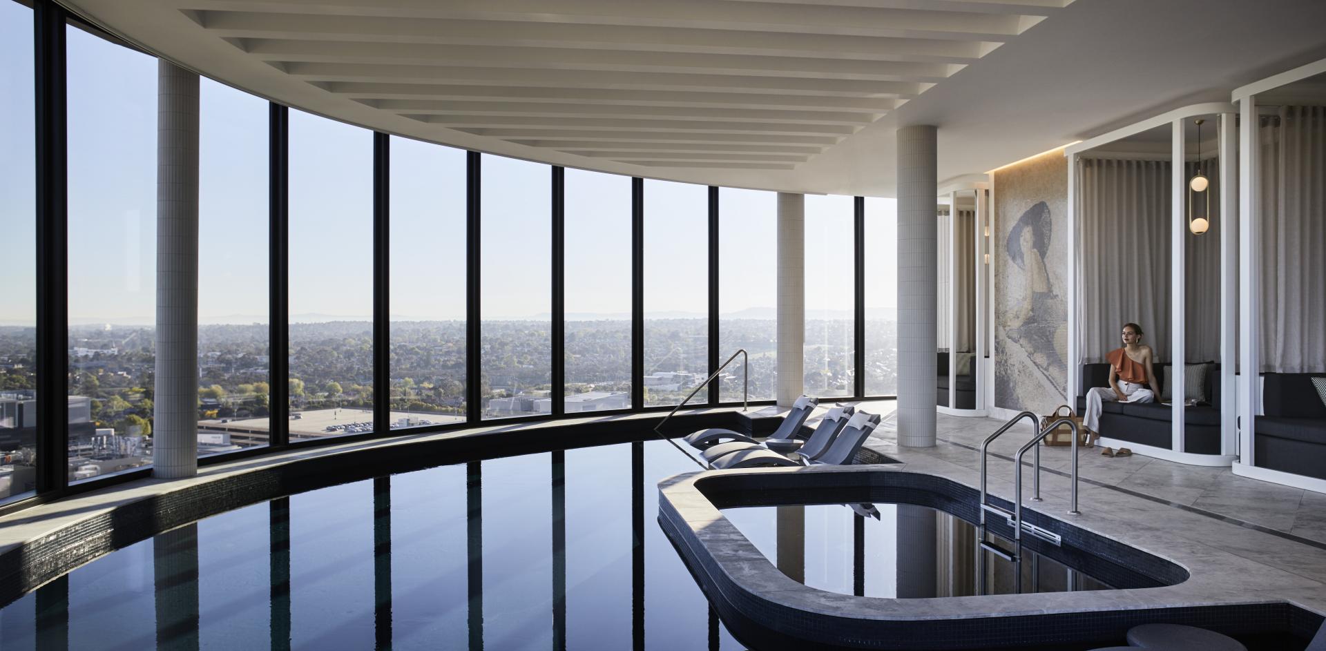 Hotel Chadstone modern indoor pool with seating area